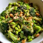 Broccoli salad with peanut sauce in bowl