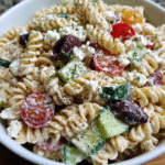 Greek style pasta salad in serving bowl