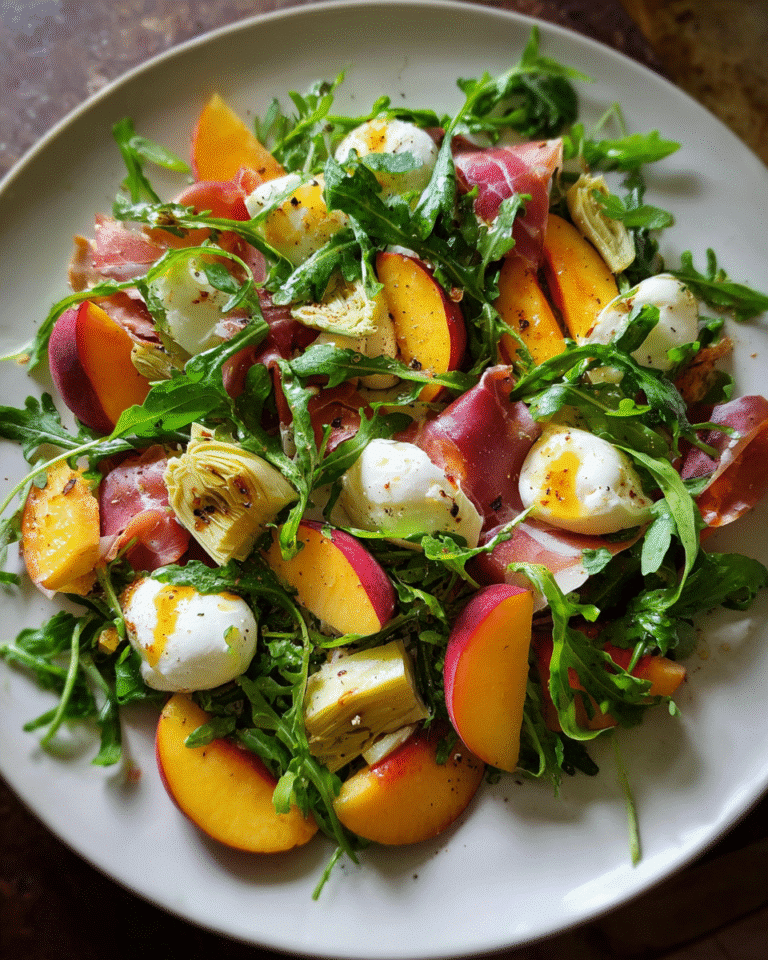 Peach salad with arugula and mozzarella on rustic plate