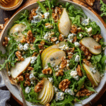 Overhead view of pear salad with blue cheese