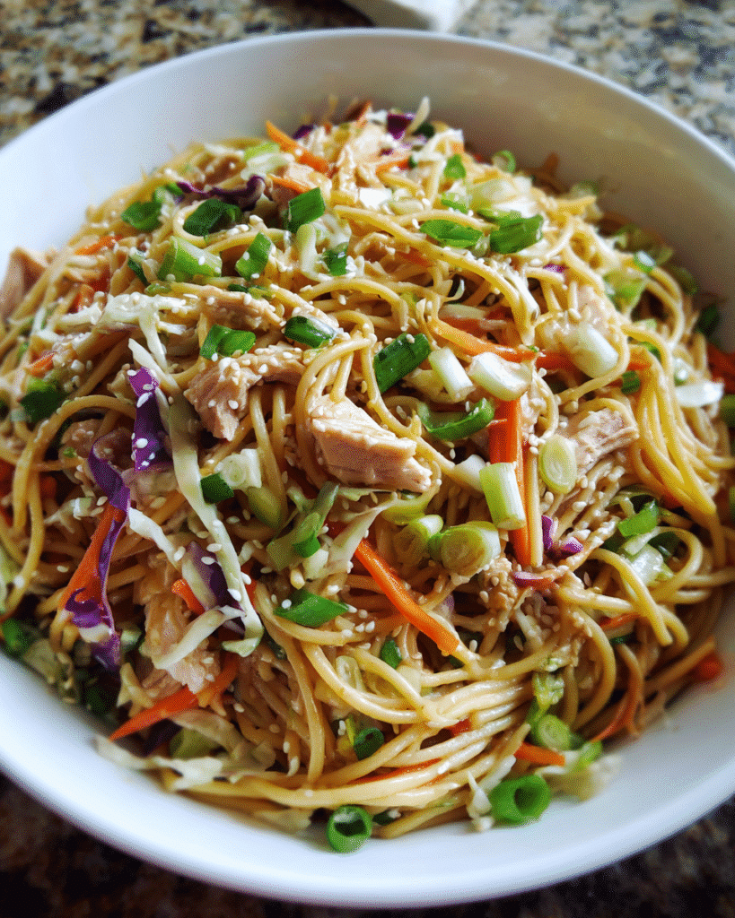 sesame noodle salad in ceramic bowl