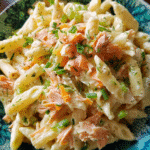 Smoked salmon pasta salad with vegetables and dill