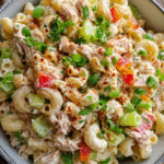 Tuna Macaroni Salad in a bowl with herbs and paprika