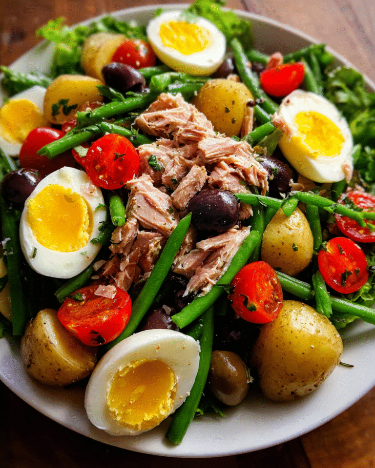 French salad with tuna on rustic plate