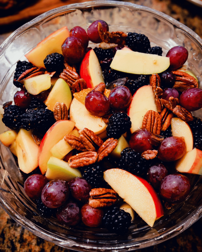 Colorful autumn fruit salad with apples and berries