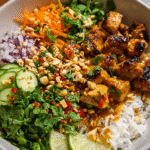 Chicken Satay Spring Roll Bowl with skewers and veggies