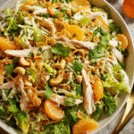 Chinese Chicken Salad in a wide bowl with toppings