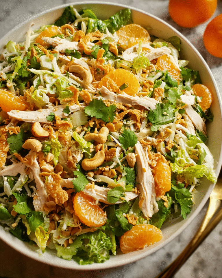 Chinese Chicken Salad in a wide bowl with toppings