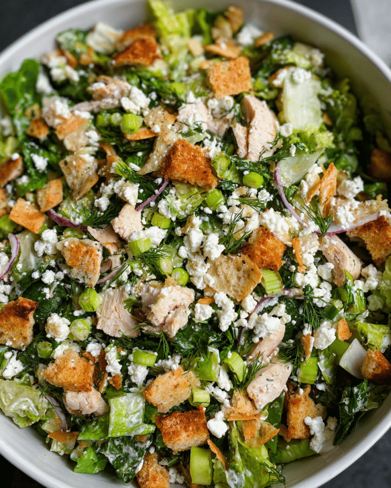 Chopped chicken salad with feta and lemon vinaigrette in bowl