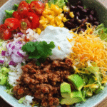 Ground beef burrito bowl with colorful toppings