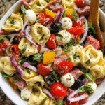 Italian tortellini pasta salad served in rustic bowl