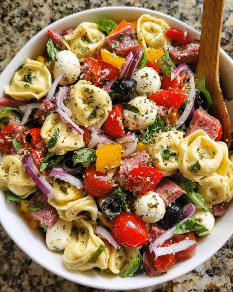 Italian tortellini pasta salad served in rustic bowl