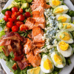 Salmon Cobb Salad with creamy avocado dressing on platter
