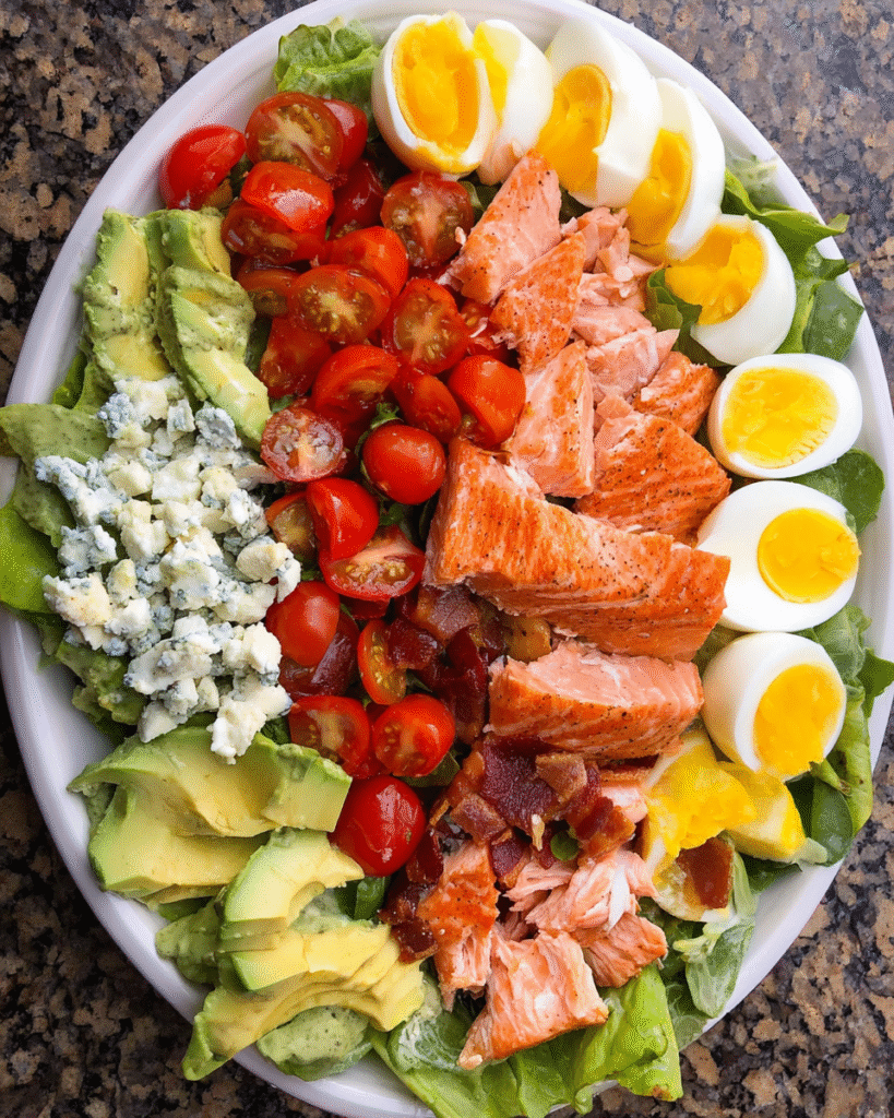 Salmon Cobb Salad with creamy avocado dressing on platter