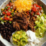 Shredded beef burrito bowl with toppings