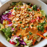 Thai Peanut Dressing surrounded by fresh ingredients