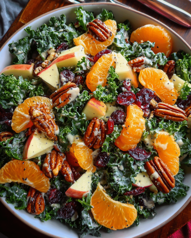 Chopped apple and mandarin salad with creamy poppy seed dressing in white bowl