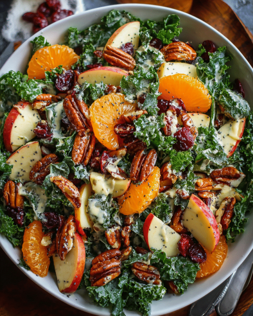 Chopped apple and mandarin salad with creamy poppy seed dressing in white bowl
