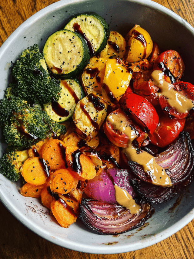 Amazing Roasted Veggie Rainbow Bowl on wooden table
