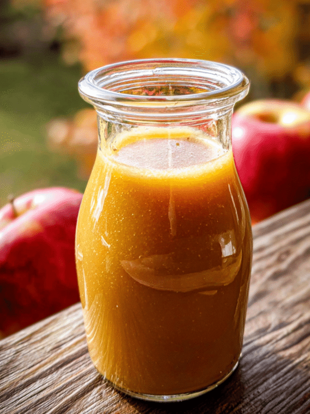 Homemade apple cider vinaigrette on rustic kitchen table