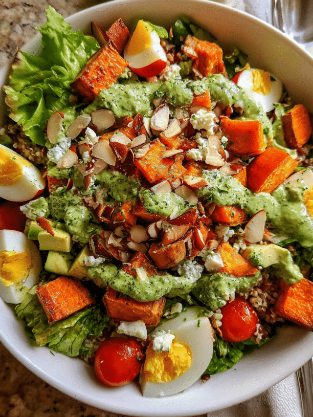Chopped Green Goddess Salad in bowl with dressing