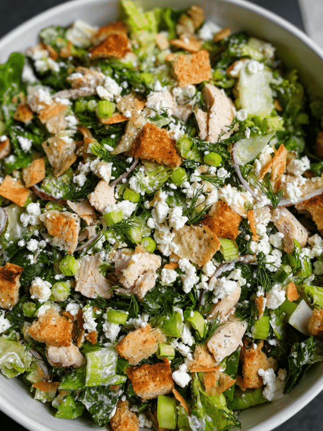 Chopped chicken salad with feta and lemon vinaigrette in bowl