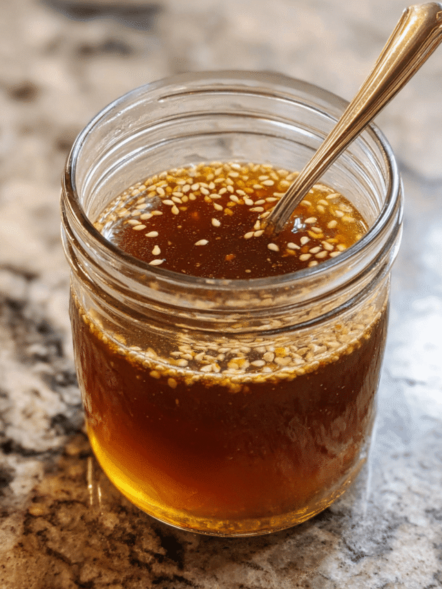 Sesame vinaigrette in glass jar with fresh ingredients