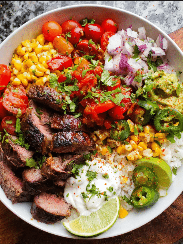 Overhead view of steak fajita bowl with colorful toppings