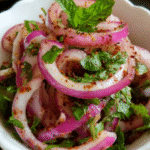 Onion salad laccha pyaz in a rustic Indian setting