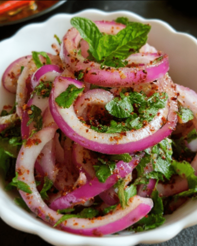 Onion salad laccha pyaz in a rustic Indian setting