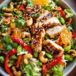 Overhead view of Asian sesame chicken and cashew salad