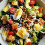 easy layered brunch salad in glass bowl