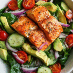 Salmon avocado salad with spinach and lemon dressing