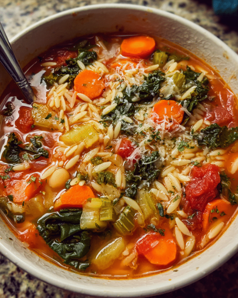 Veggie Orzo Soup in a bowl with vegetables and pasta