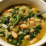 White Bean and Spinach Soup in rustic bowl