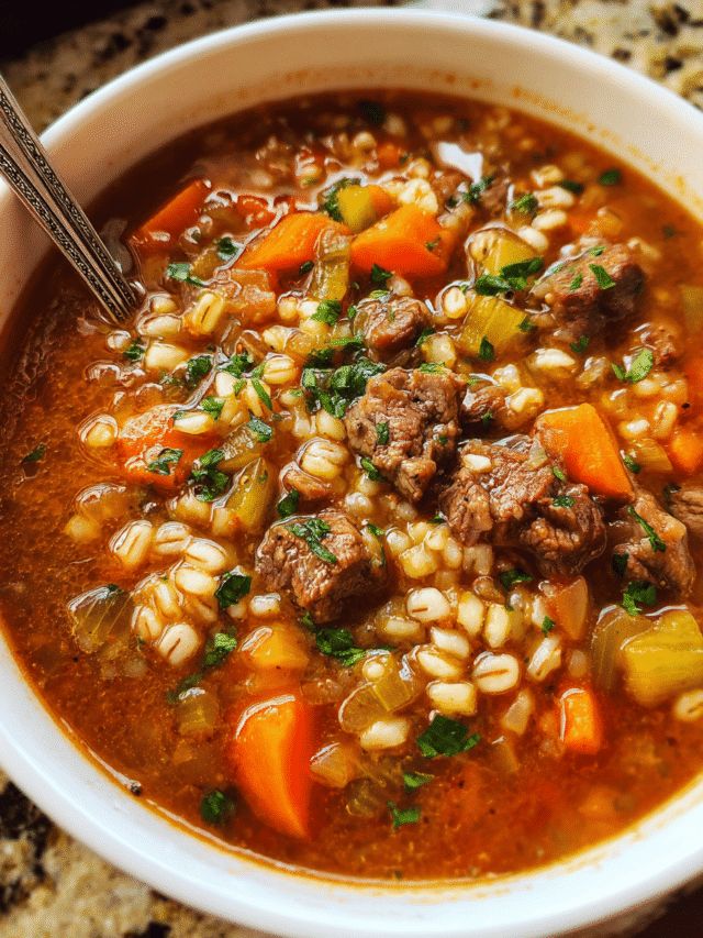 Hearty bowl of Beef Barley Soup with parsley garnish