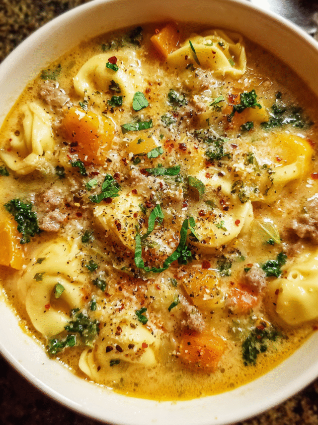 Creamy Butternut Squash Sausage and Tortellini Soup in a bowl with kale and Parmesan