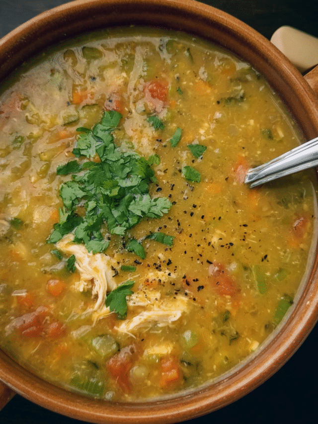 Bowl of creamy Mulligatawny Soup with chicken, lentils, and cilantro