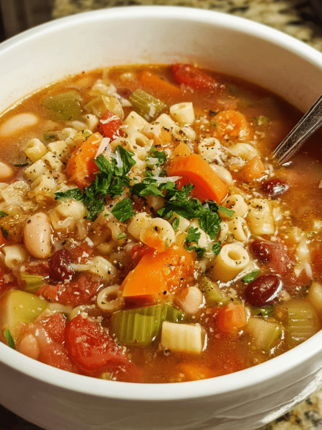 Hearty bowl of pasta e fagioli in rustic Italian kitchen