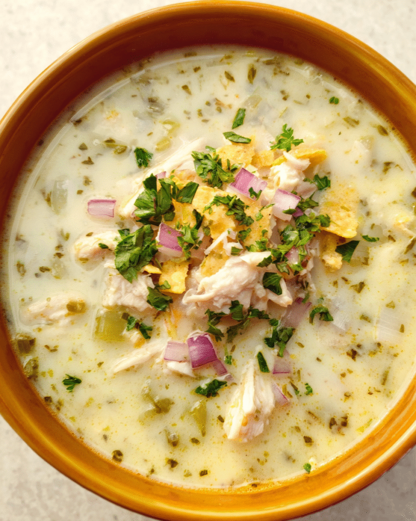 Creamy Chicken Verde Tortilla Soup in a serving bowl