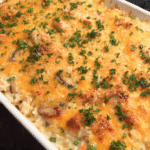 Creamy baked chicken and rice casserole with cheddar topping