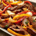 Easy Sheet-Pan Beef Fajitas with steak and peppers