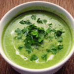 Green Detox Soup in a bowl with fresh herbs
