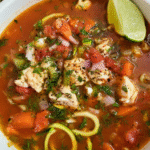 Mediterranean Fish Soup with halibut, vegetables, and fresh herbs