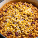 Turkey chili mac in a skillet with melted cheese
