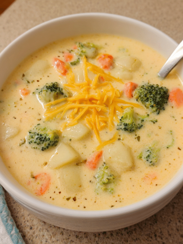 Cheddar Broccoli Potato Chowder in a bowl with fresh vegetables