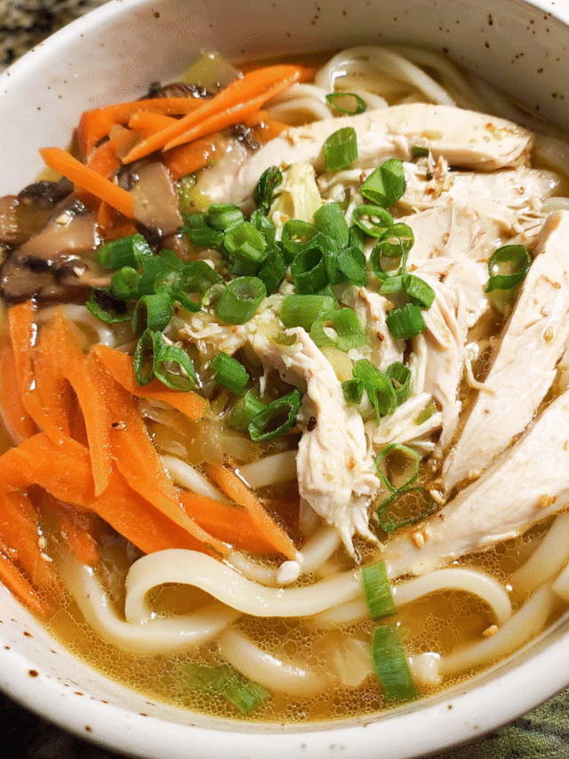 Bowl of chicken udon soup with noodles and vegetables