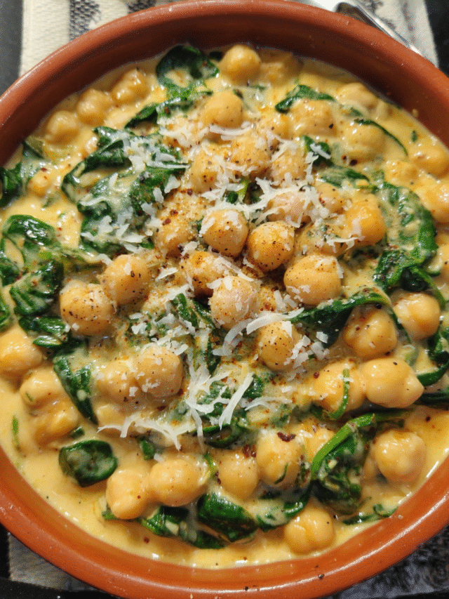 Chickpeas and spinach in creamy sauce served warm in a bowl