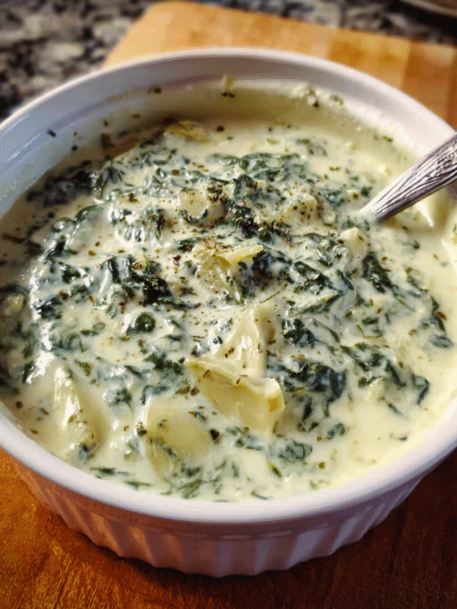 Creamy Spinach Artichoke Soup in a bowl with parmesan garnish