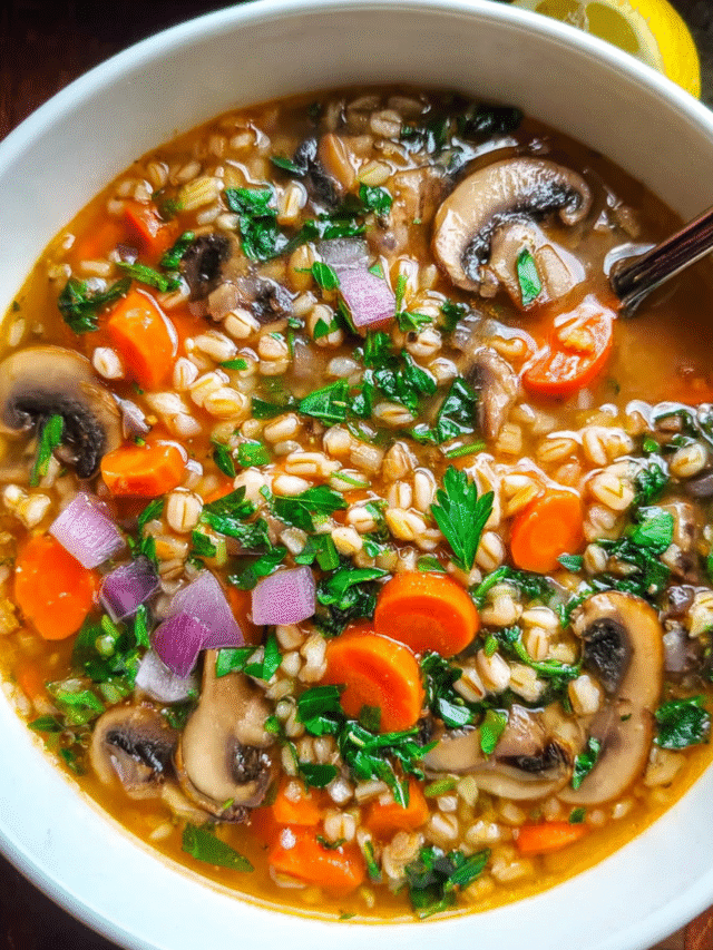 Bowl of homemade Mushroom Farro Soup with herbs